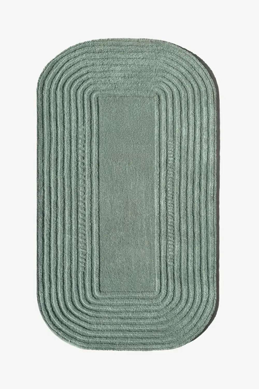Sage green oval rug with concentric carved lines, a minimalist Japandi-inspired 4x6 or 5x7 organic wool rug for entryways or bedrooms