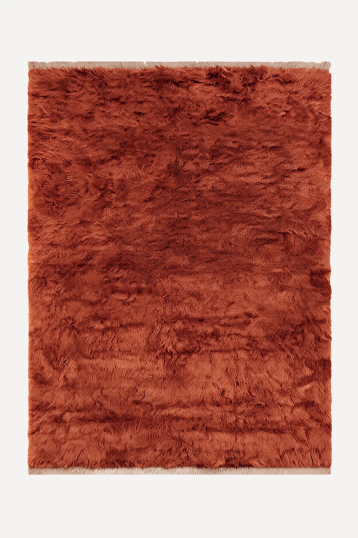 Burnt Orange hand-knotted shag wool rug by JUBI, shown flat from above