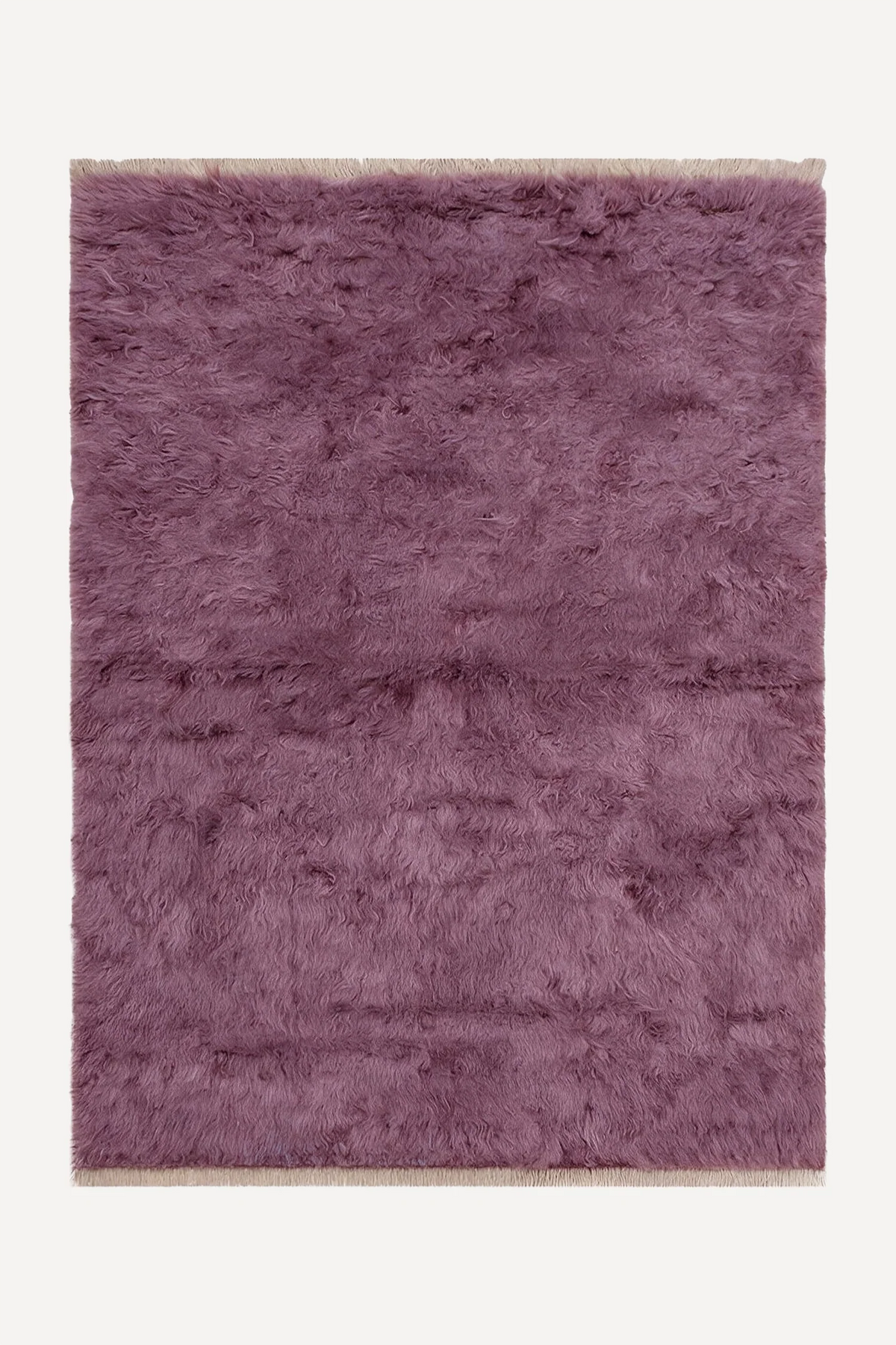 Mauve hand-knotted shag wool rug by JUBI, shown flat from above
