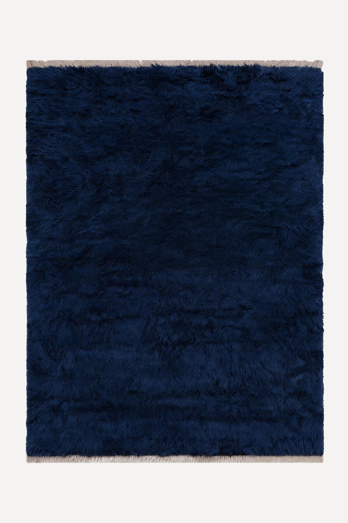 Navy hand-knotted shag wool rug by JUBI, shown flat from above
