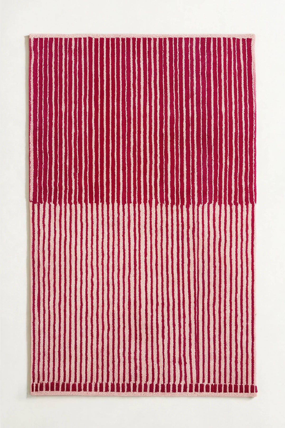 hot pink and cream striped rug with unique half tone design hand tufted in wool